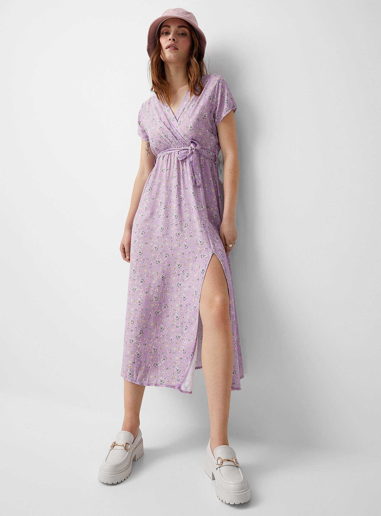 A person wearing the dress with loafers