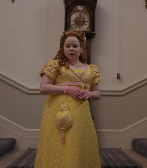 the sleeves of the dress are covered in bows