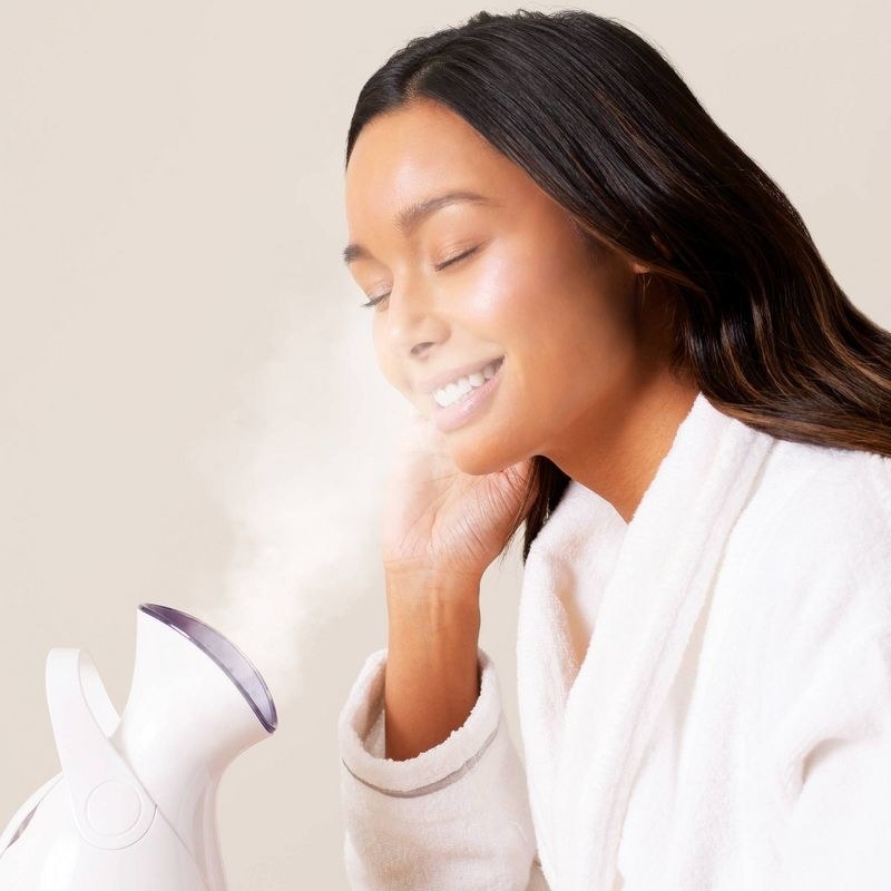 a model using the face steamer