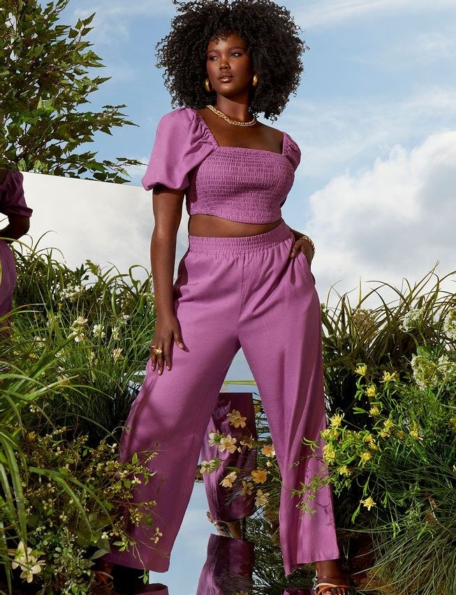 model in purple linen short sleeve cropped smocked top and pull on pants