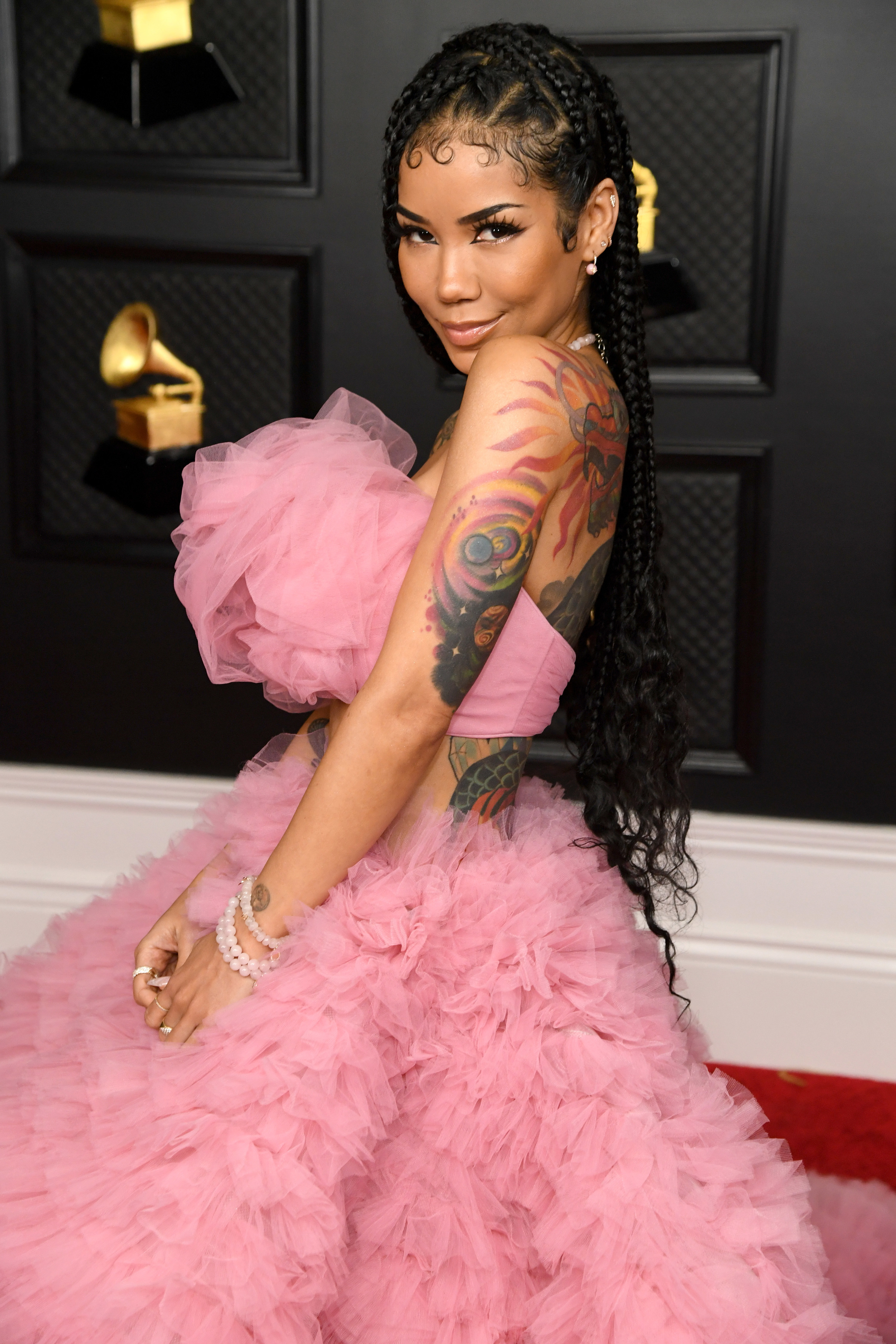 Jhené Aiko poses on the red carpet at the Grammys