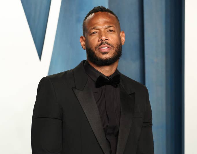 Marlon posing for photographers at the Vanity Fair Oscar party