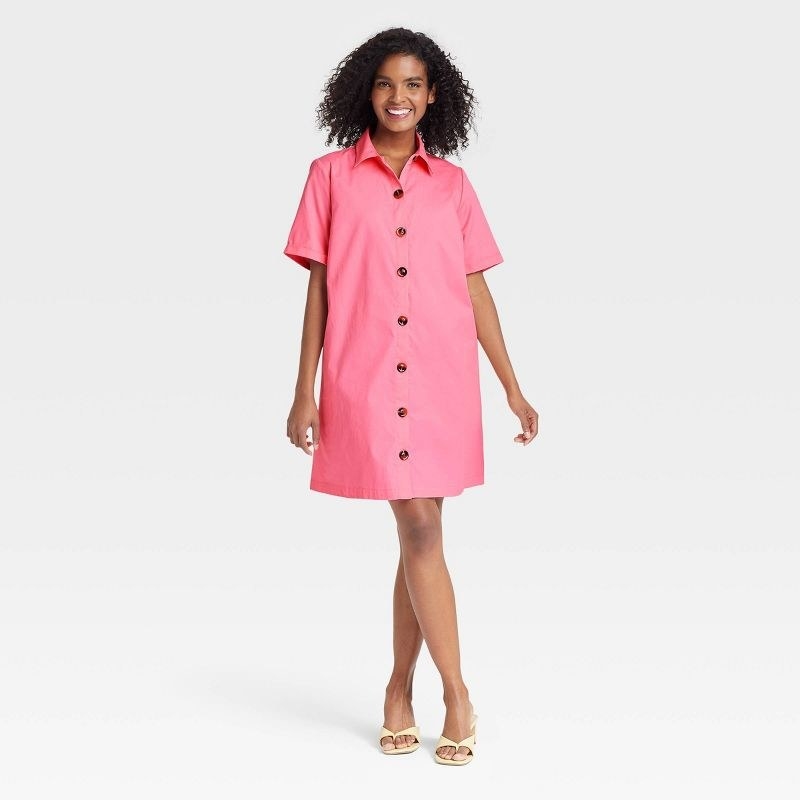 Model wearing the pink short sleeve dress