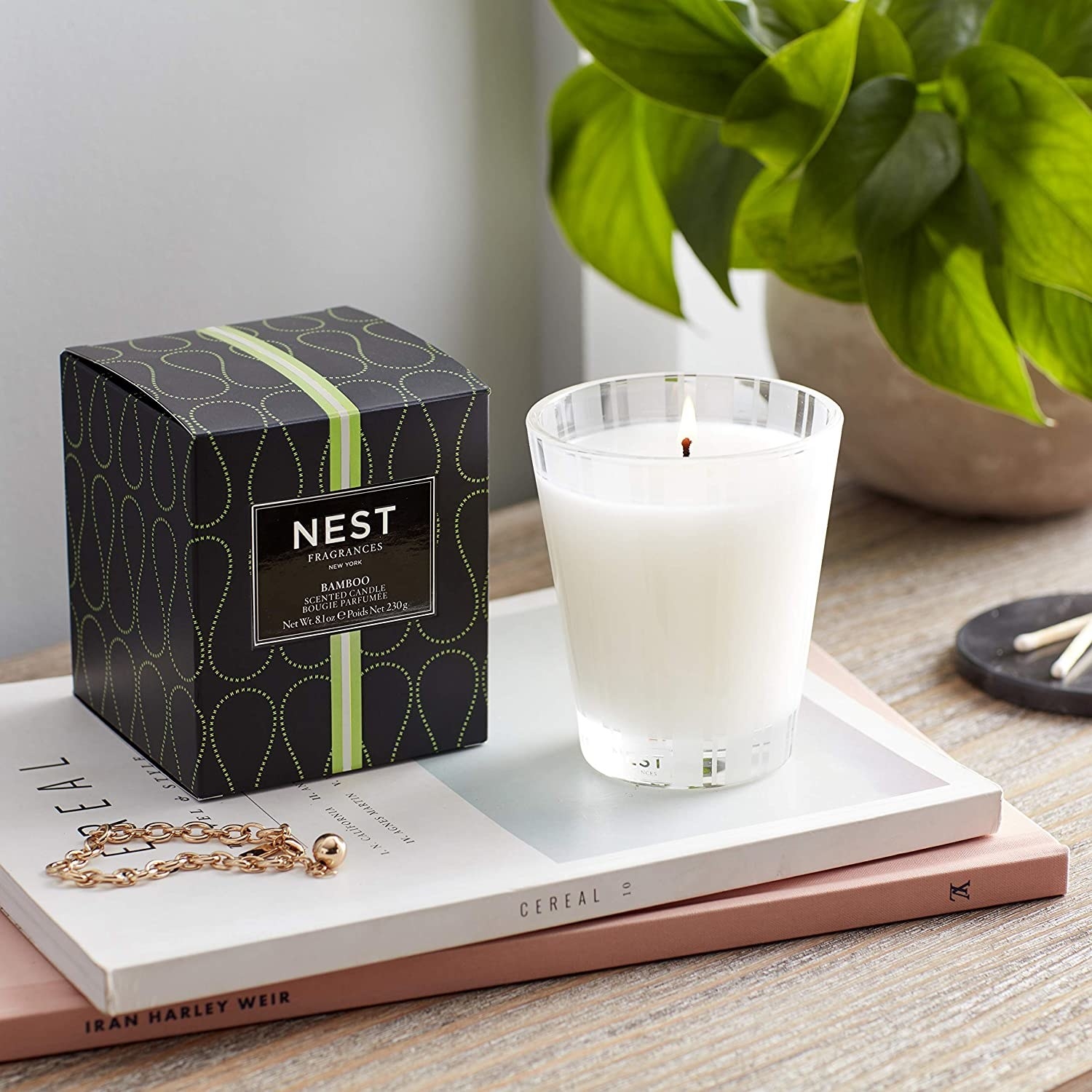 a nest candle on an aesthetic dresser