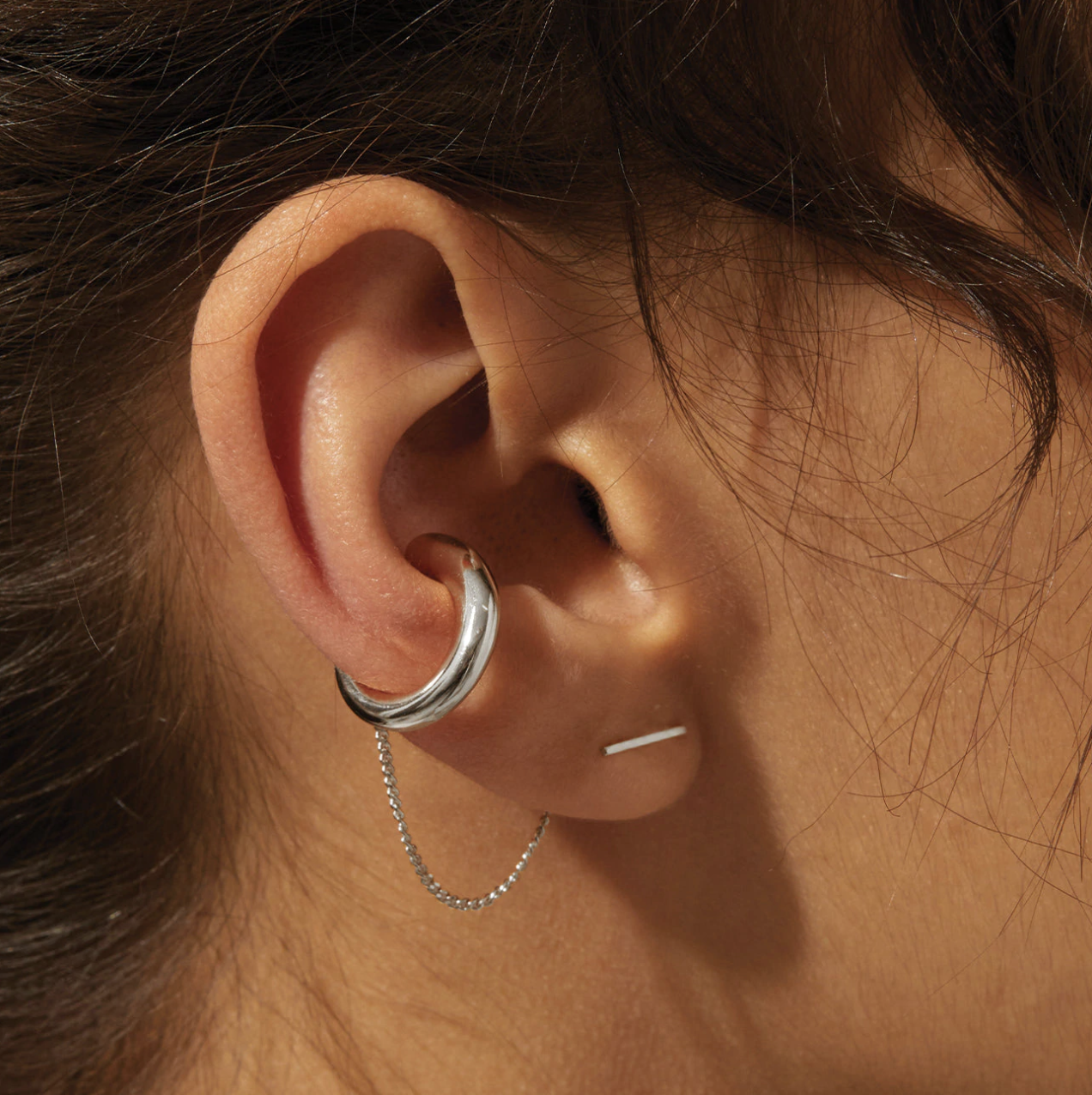 a close up of the ear cuff on a person&#x27;s ear