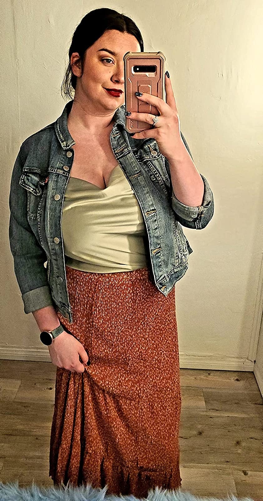 a reviewer wearing the top in green