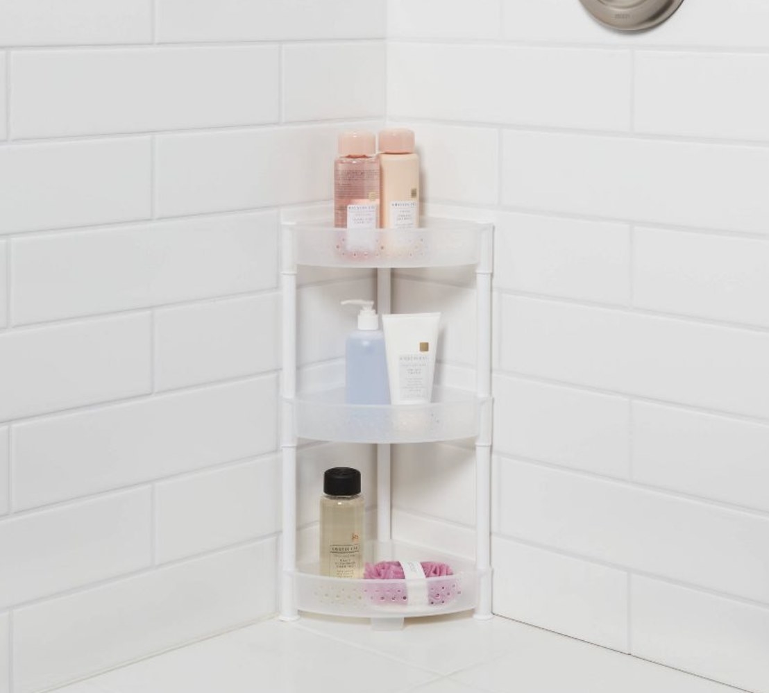 A tower shower caddy in a shower