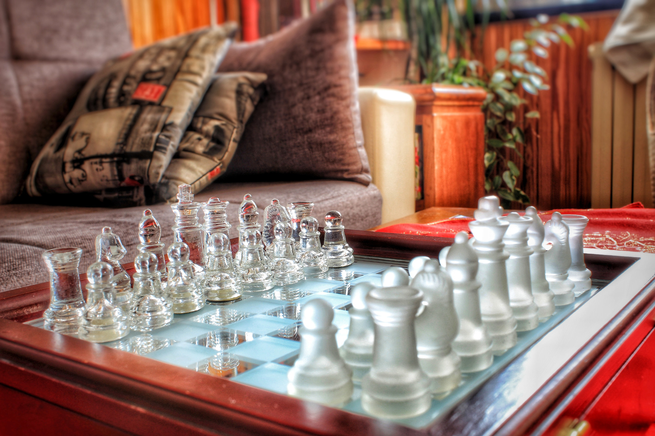 a glass chess set on a table