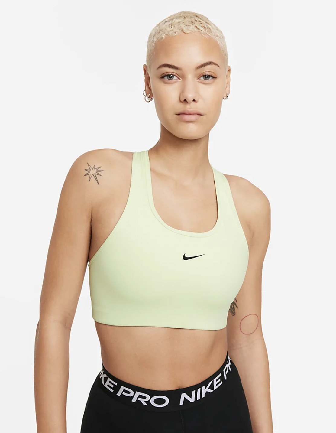 Model wearing the green sports bra