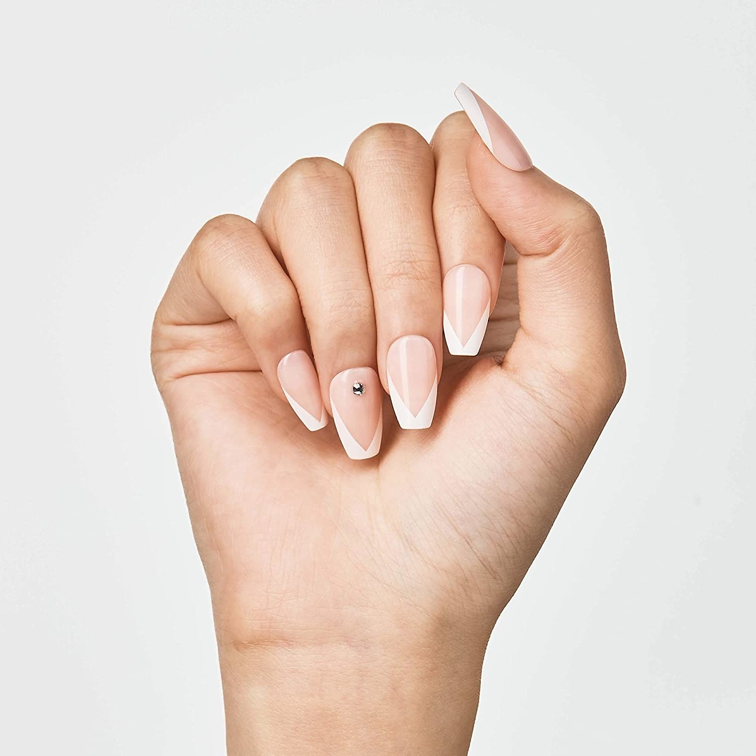 A person's hand with press-on nails