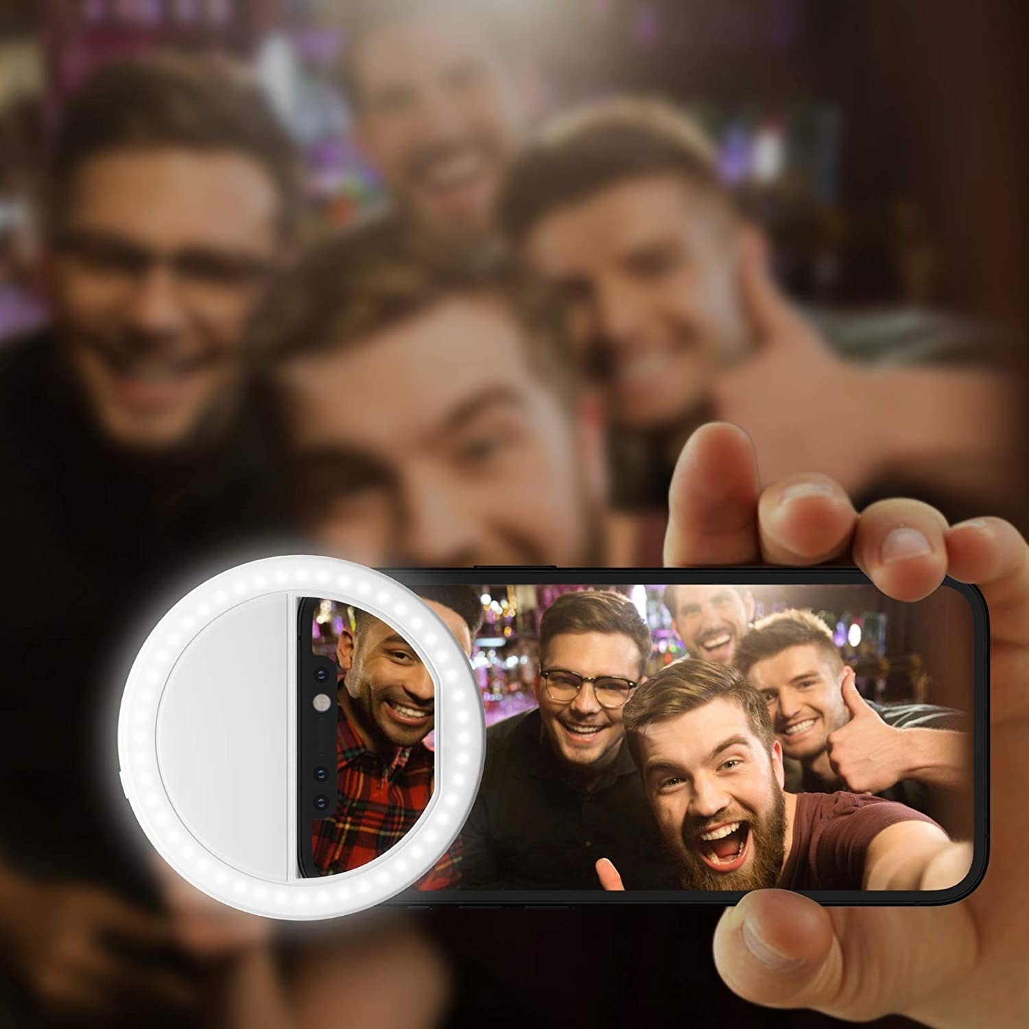 clip-on selfie ring light on smartphone with picture of group of friends