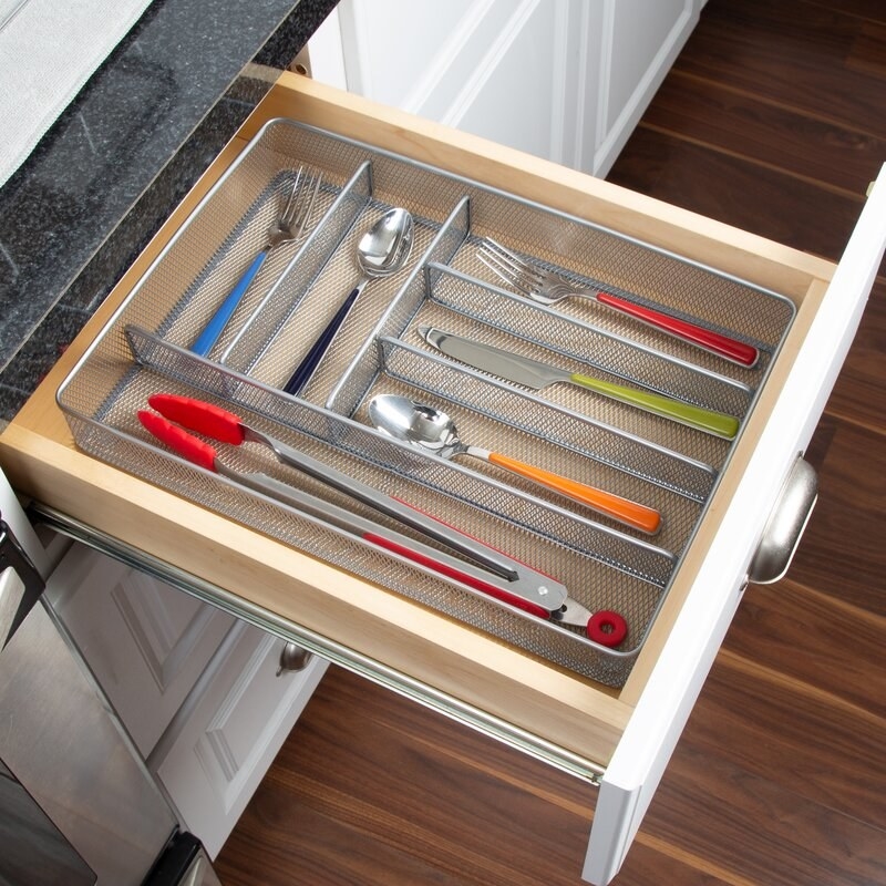 An image of a kitchen draw organizer that is two inches high and 11.25 inches wide