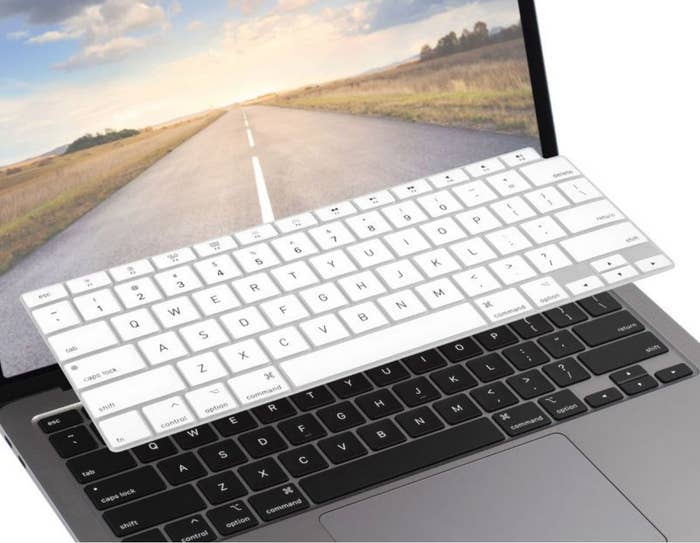 White silicone keyboard cover over laptop