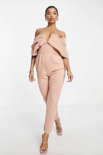 a model in the pink jumpsuit