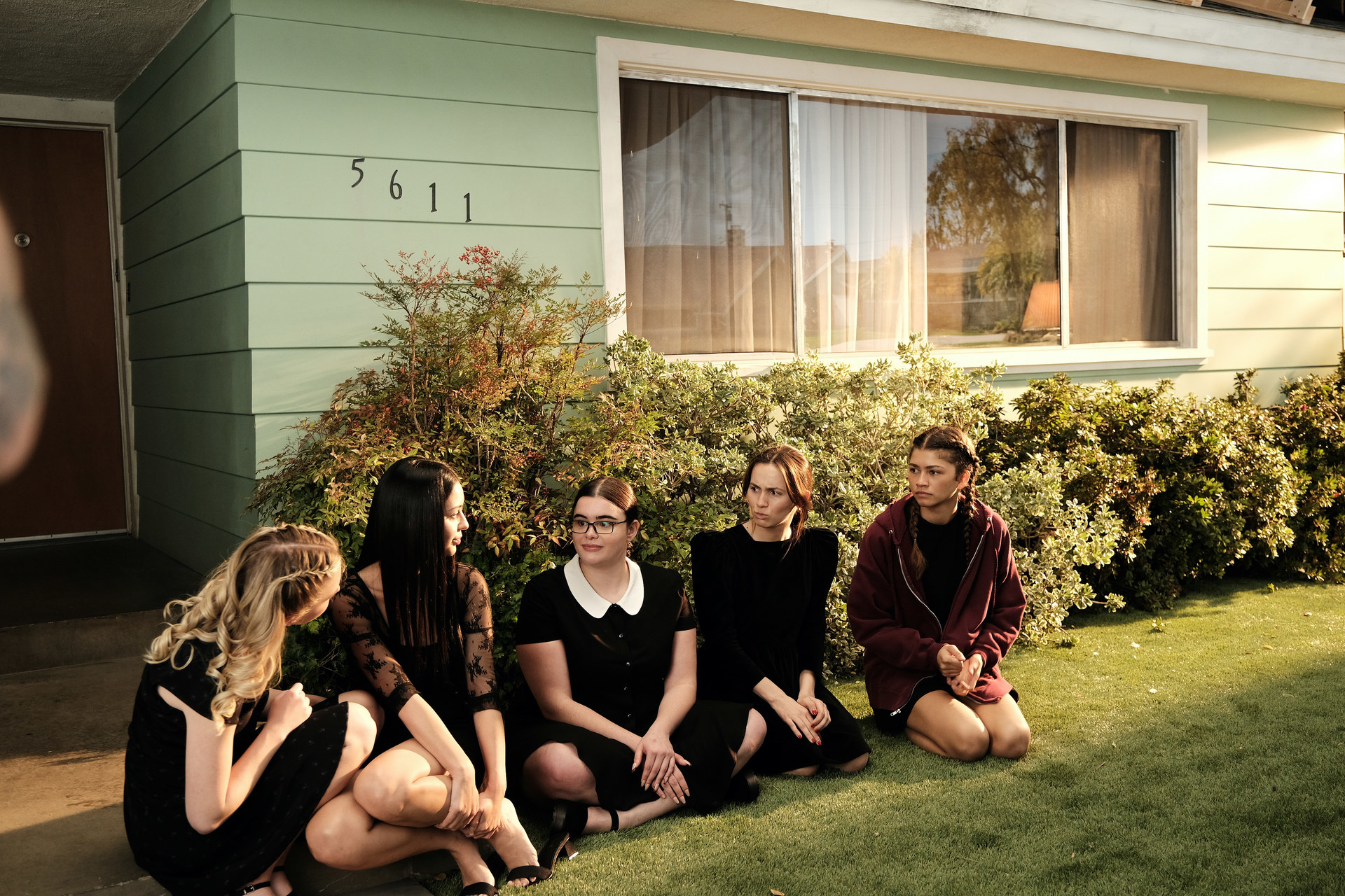 The girls sit outside of a house in Lexi&#x27;s play in HBO&#x27;s Euphoria.