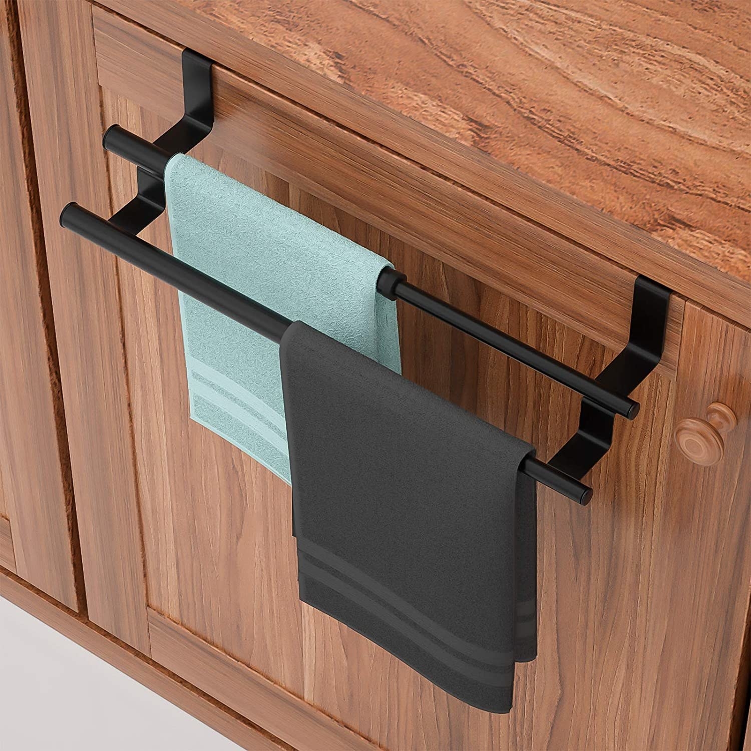 The towel racks hanging over lower kitchen cabinets in a kitchen