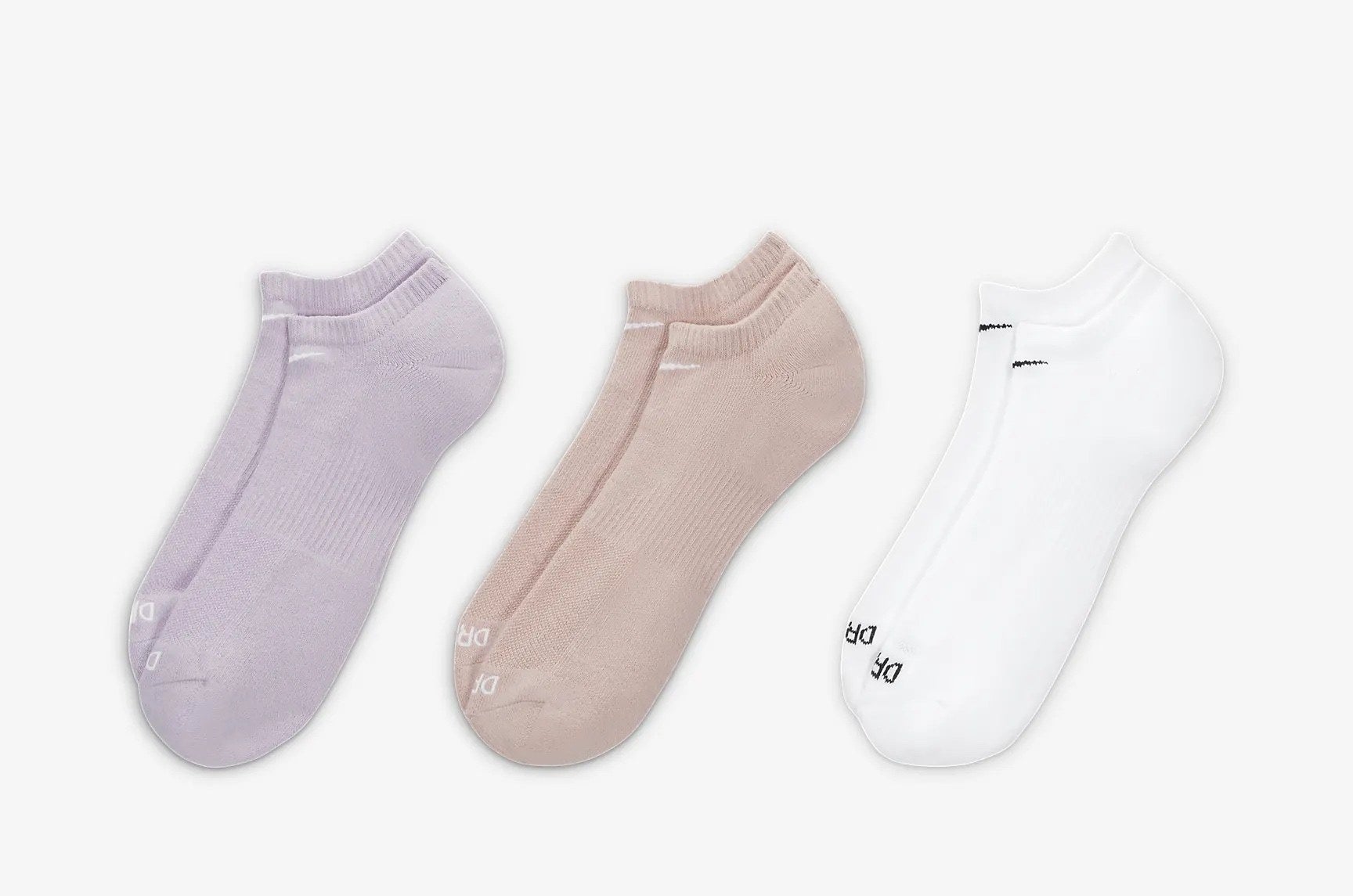 Three pairs of the socks in purple, tan, and white