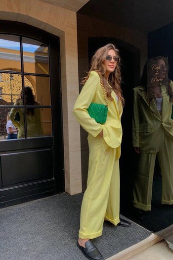 a model in a yellow suit