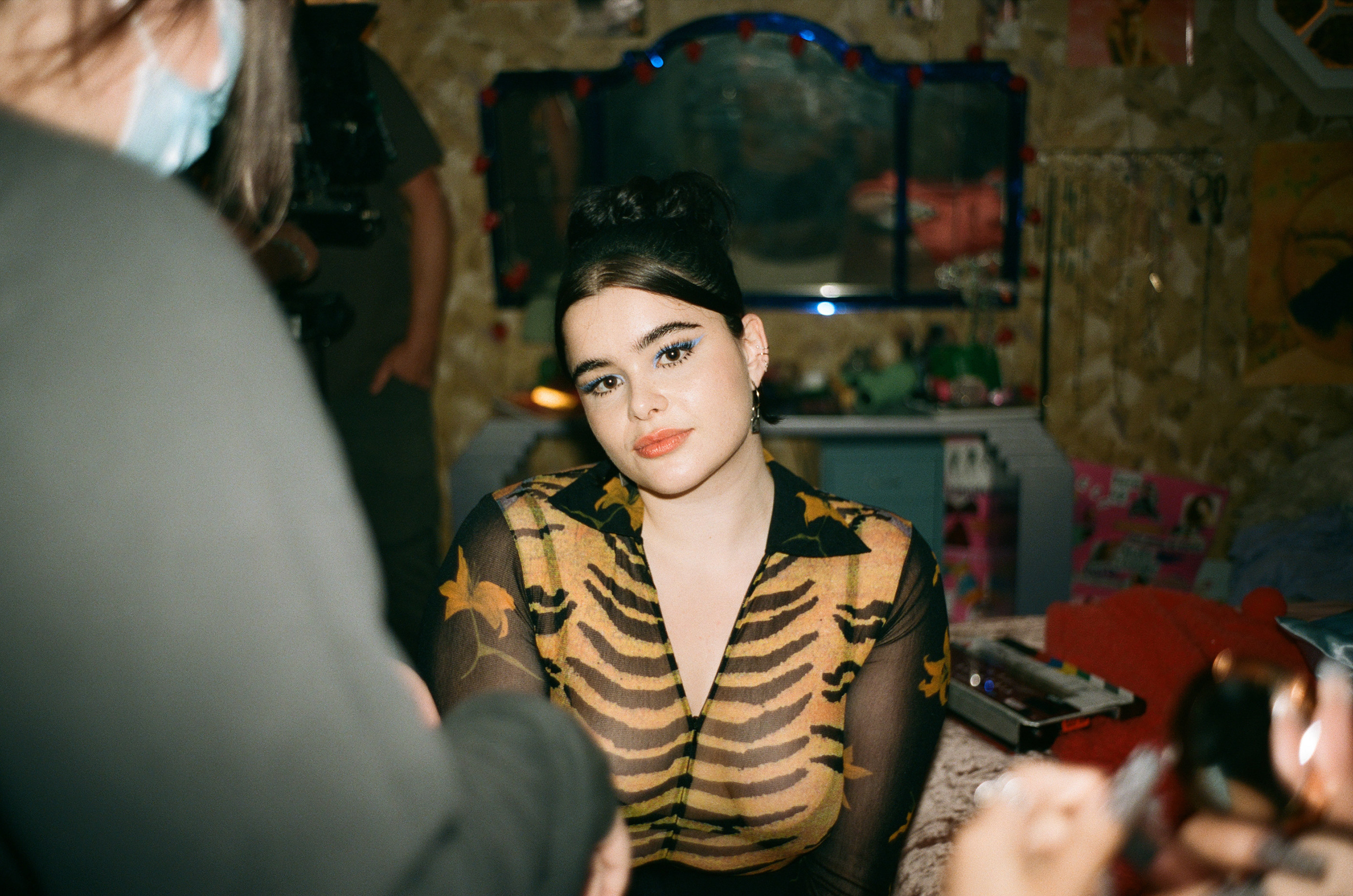 Barbie Ferreira on set with people in the foreground 