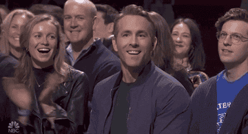 Ryan Reynolds on Saturday Night Live putting his hand to his chest in thanks
