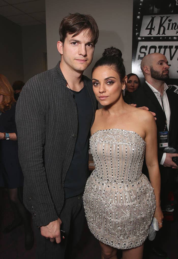 The couple are glammed up for an event, Mila wearing a short bedazzled strapless dress