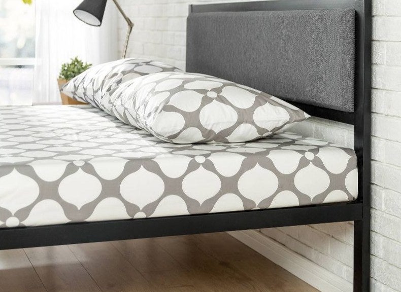 An image of a metal platform bed frame with a headboard included
