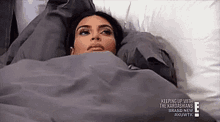 Kim Kardashian lying in bed