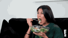 Kourtney eating a salad