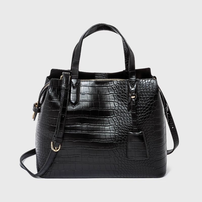the black alligator print handbag