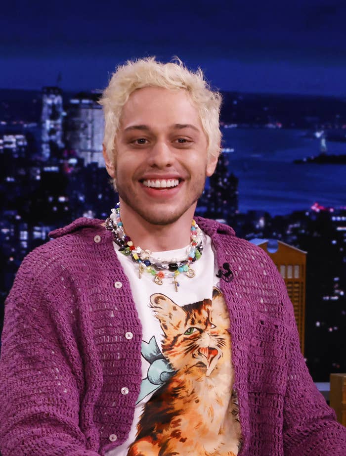 A closeup of Pete smiling as he's being interviewed on a late-night tv show