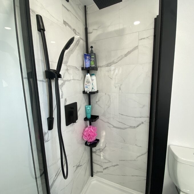 Different review photo of shower rod in a showe