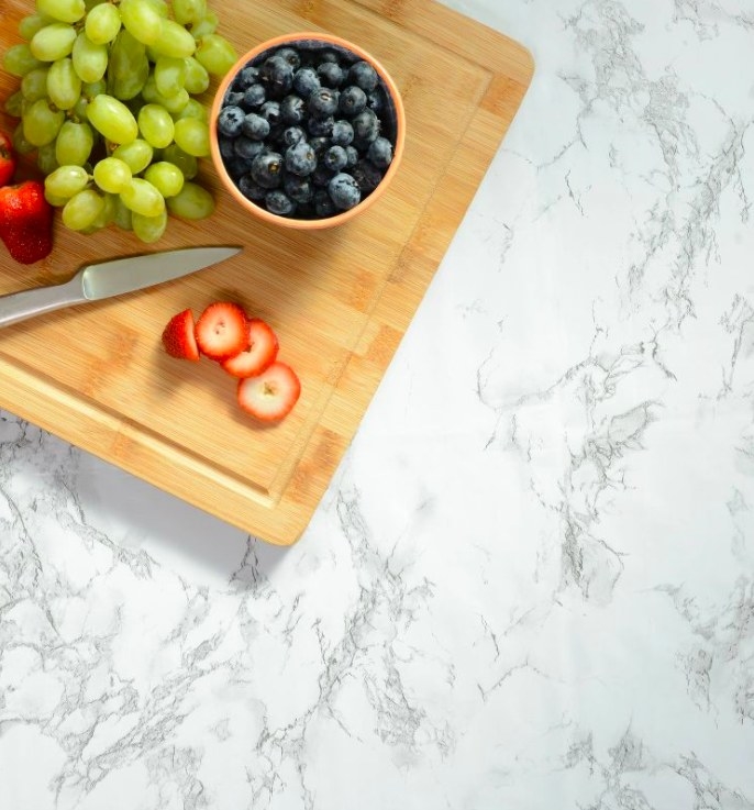 Cutting board with fruit on surface covered with marble contact paper