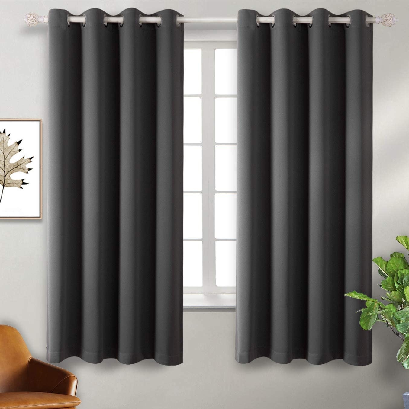 A pair of curtains hanging from a window in a living room