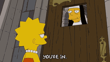 GIF of nun talking to Lisa Simpson through a door, saying, &quot;You&#x27;re in.&quot;