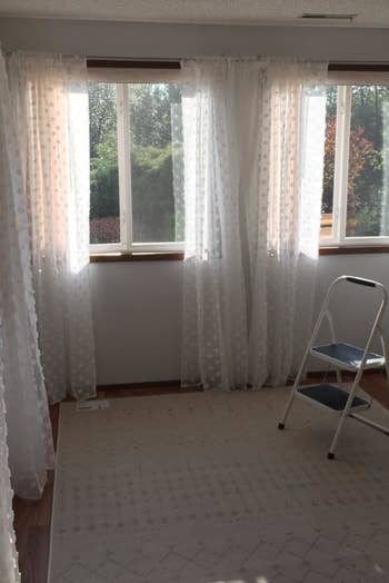 reviewer image of windows with the pom pom curtains