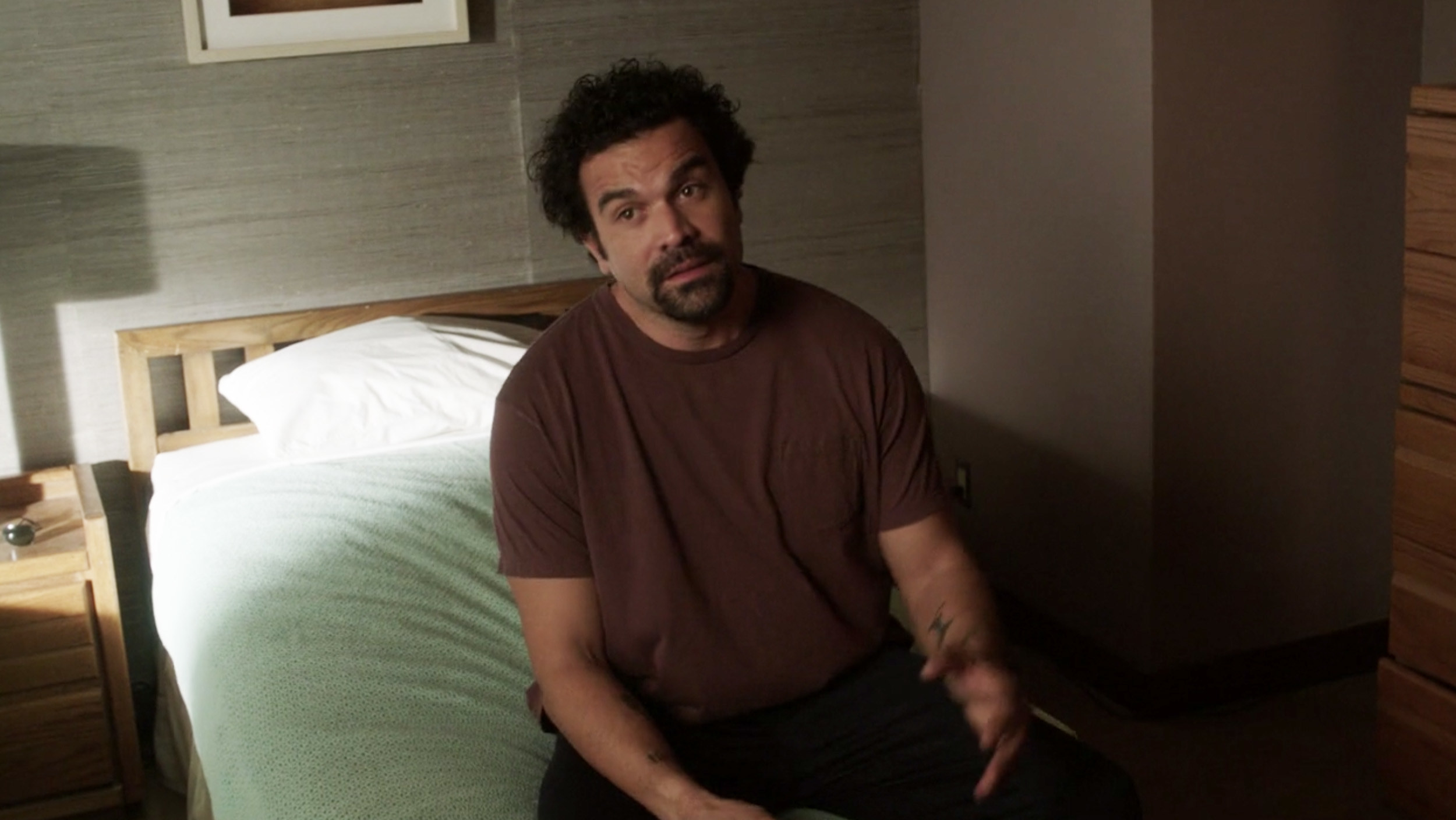 Carlos from &quot;Desperate Housewives&quot; sitting on a bed in rehab