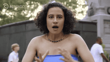 a gif of ilana glazer in broad city making a really relieved face