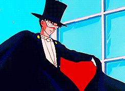 GIF cartoon man in tuxedo and mask and cape