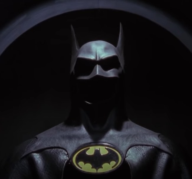 The Batsuit on display with its iconic yellow emblem and black bat symbol