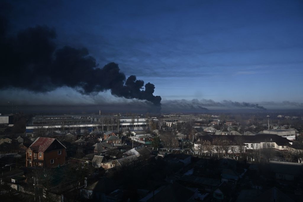 Smoke billowing into the air over a town