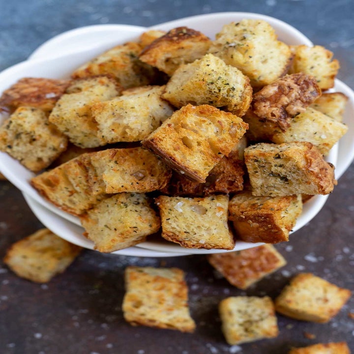 A bowl of golden brown croutons.