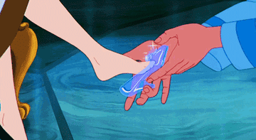 Footman putting glass slipper on Cinderella