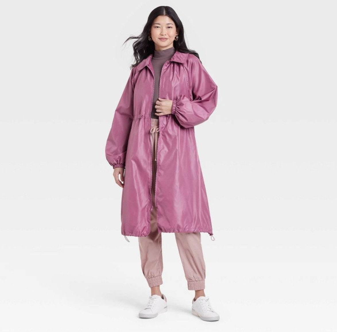 a model wearing the pink coat