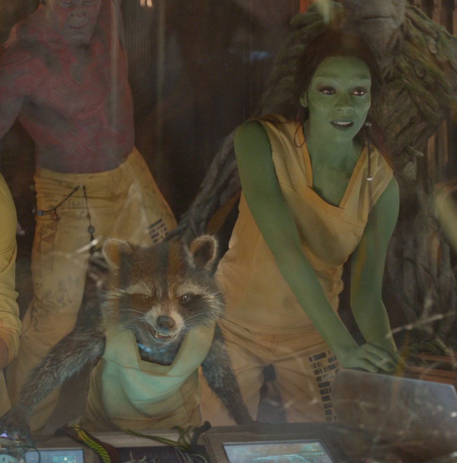 still wearing their prison uniforms, Rocket and Gamora ride a stolen ship to break out of jail