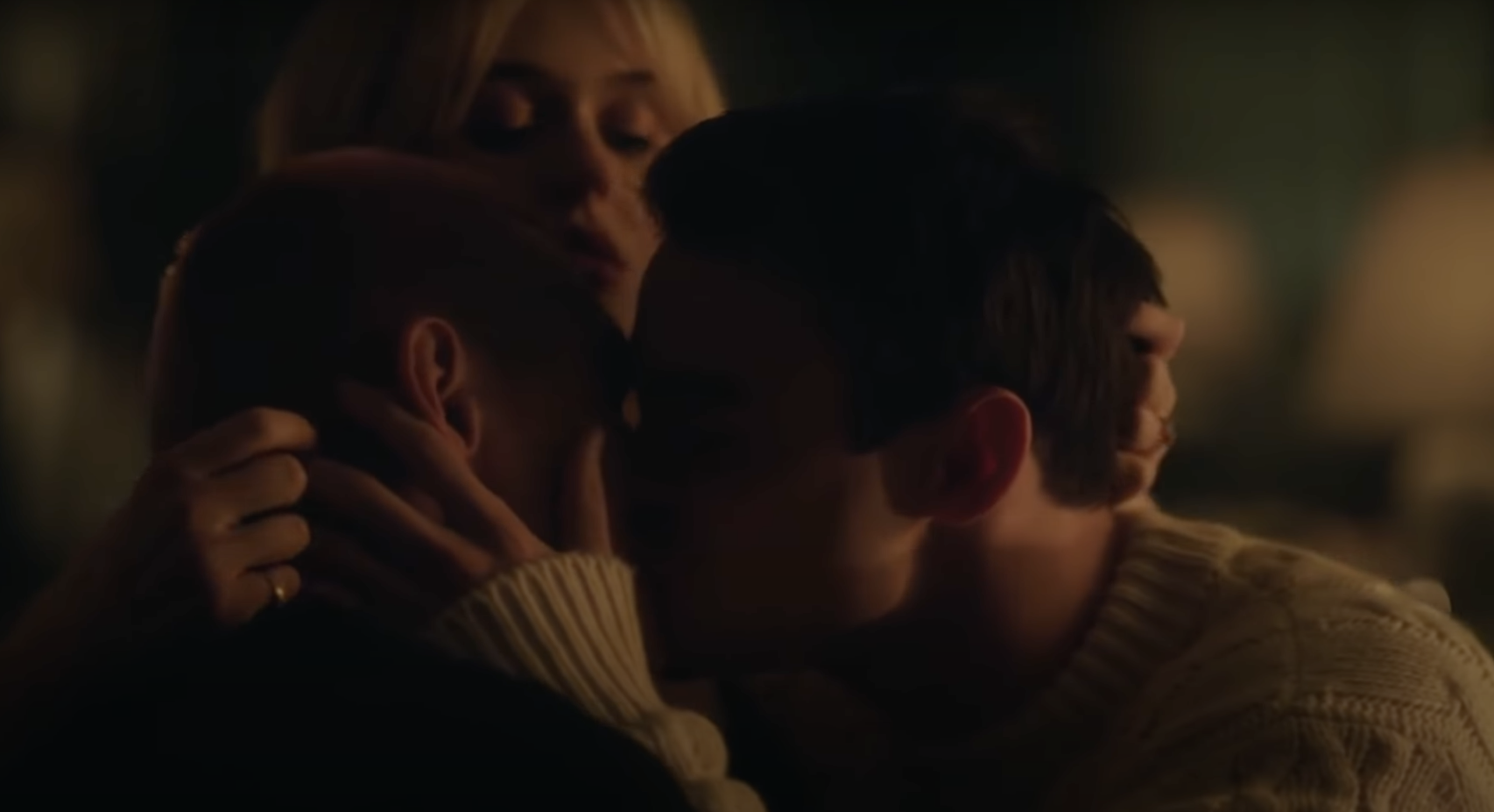 Aki, Max, and Audrey all kissing