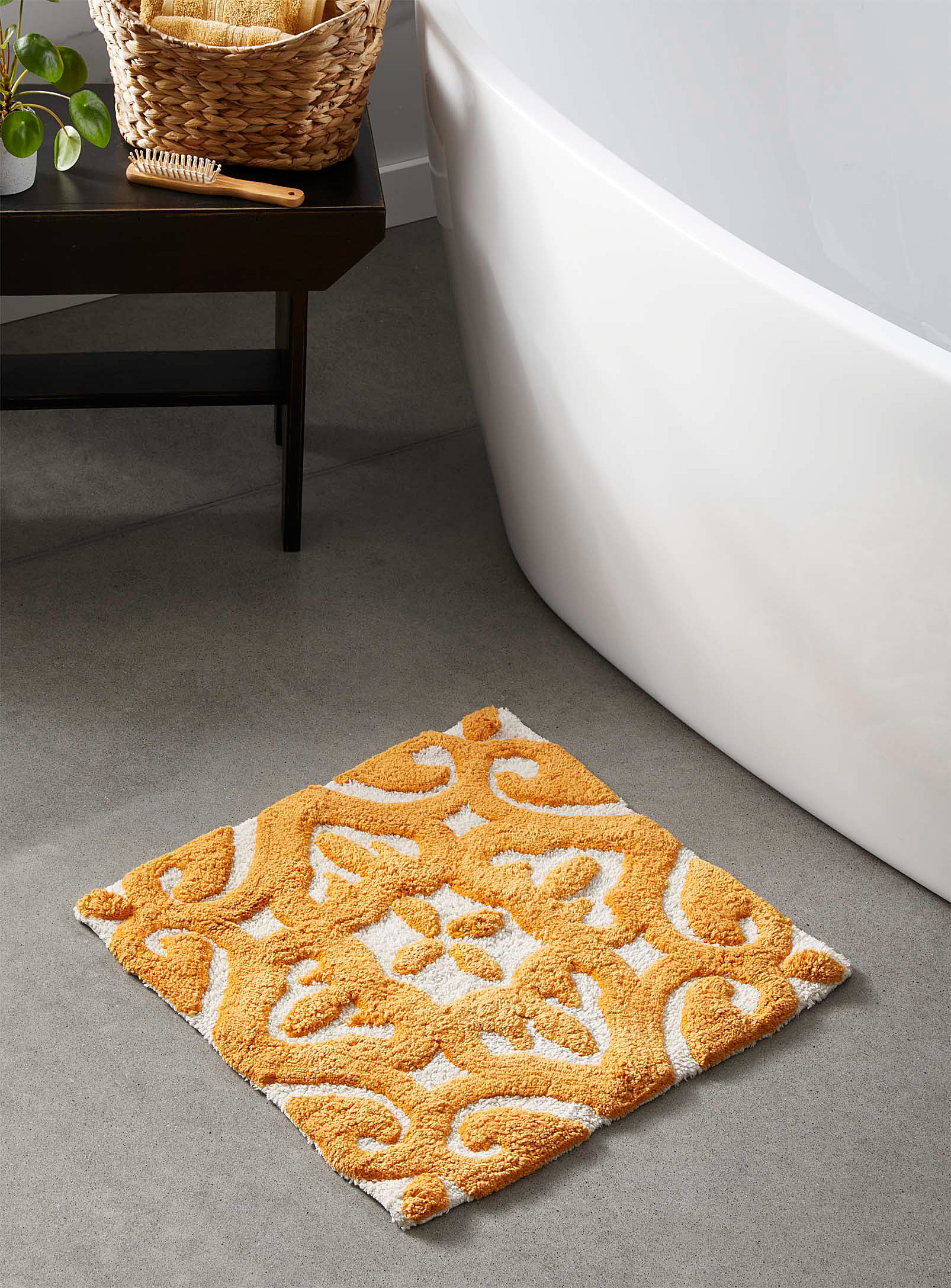 a square bath mat with colourful, moroccan-inspired designs