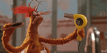 Gif of Pepe doing hair in The Muppets
