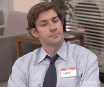 Jim from &quot;The Office&quot; tapping a name tag that reads &quot;Dave&quot;