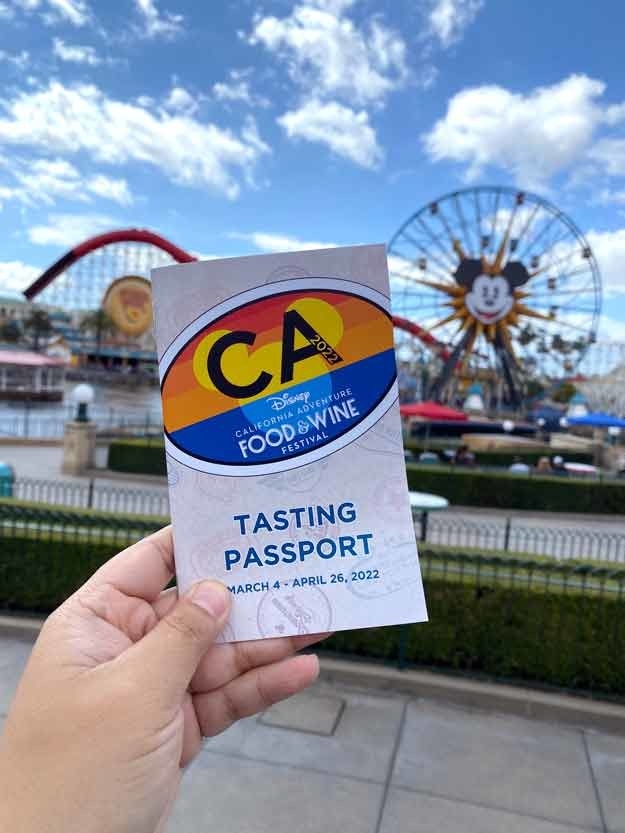 close-up of the tasting passport with Pixar Pier in the background