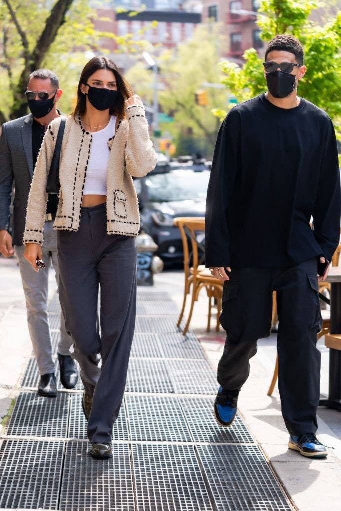 dressed in cozy, casual sweaters, Kendall and Devin walk down the Soho streets together
